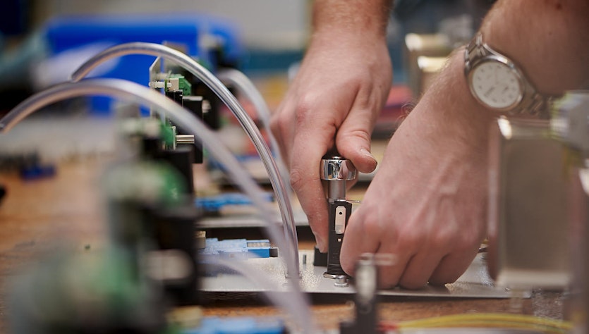Two hands working on system set-up