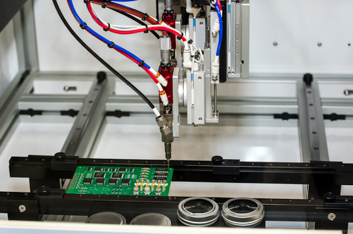 Dispenser automatically applies conformal coating to an assembled printed circuit board