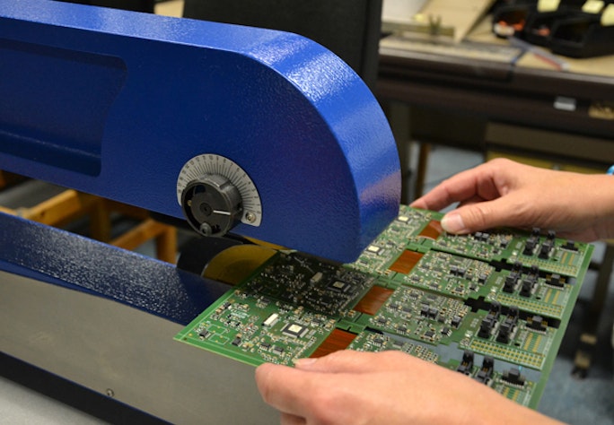 Circuit boards are cut with a saw for further use