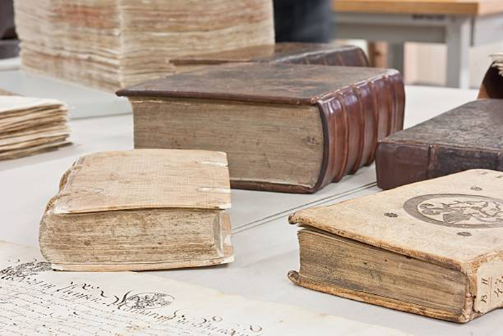 Books to be restored are on a table